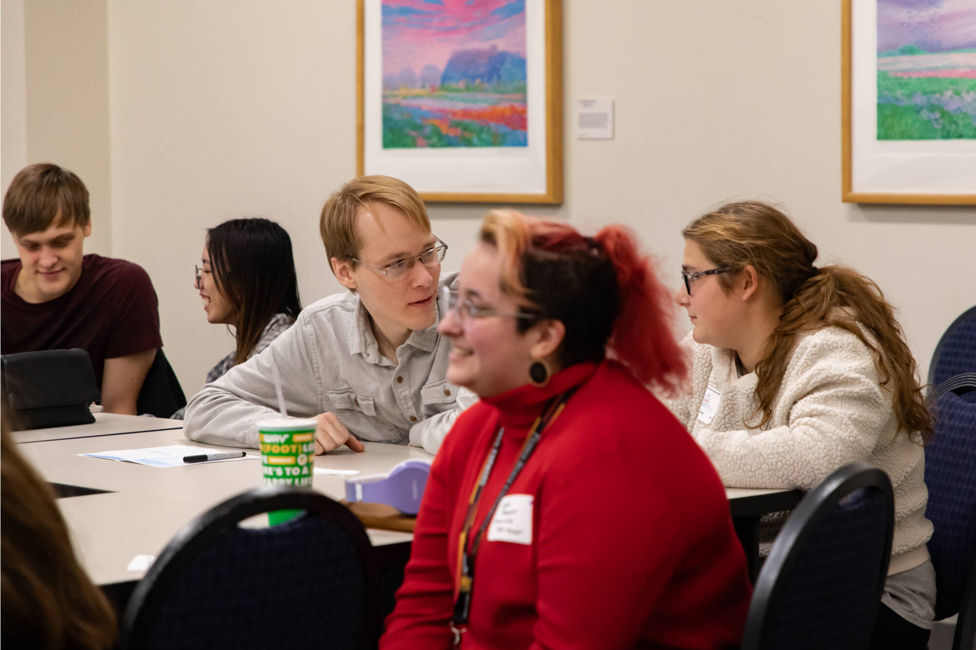 CareerDay2023 participants sited at a table talking and smiling
